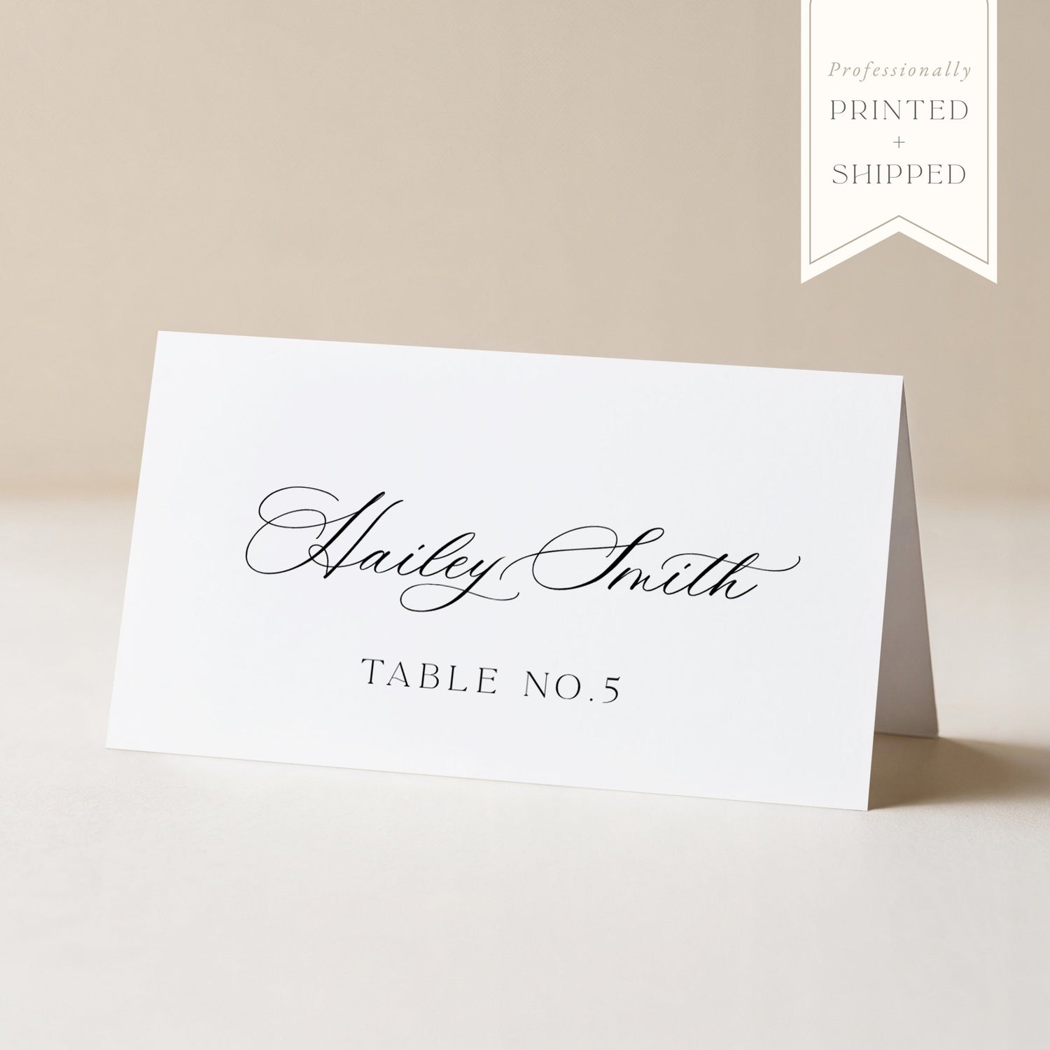 White place card with black text on a beige background