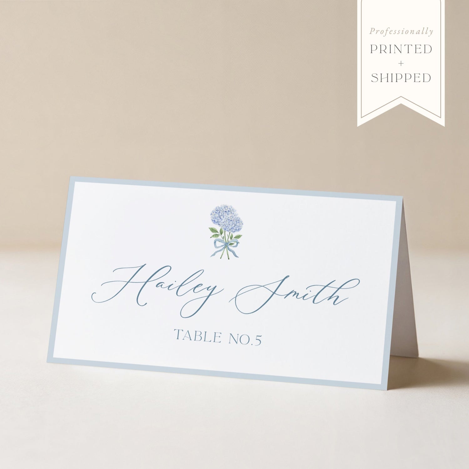 Place card with floral design and text on a beige background